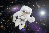 Fototapeta Kosmos - Astronaut surfing dark space. Planets stars. Space scene. The elements of this image furnished by NASA.
