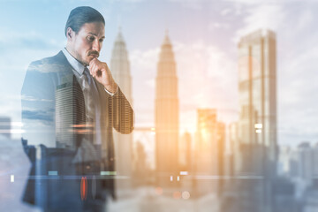 Wall Mural - Find a solution concept with pensive businessman and blurry skyscrapers background