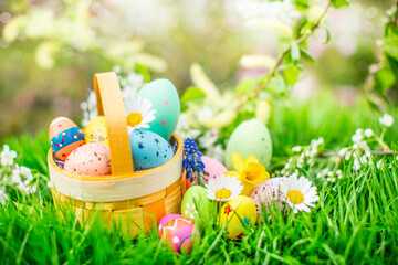 beautiful easter basket with easter eggs. easter basket with sweets and colorful eggs in spring.beau