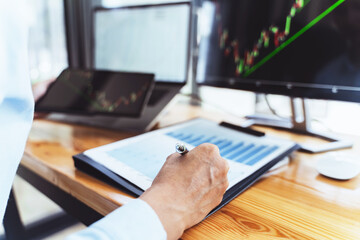 Investment planing and strategy concept..financial data analysis graph business analytics and intelligence of finance performance