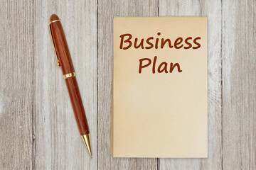 Sticker - Business plan message on old paper notepad with a pen