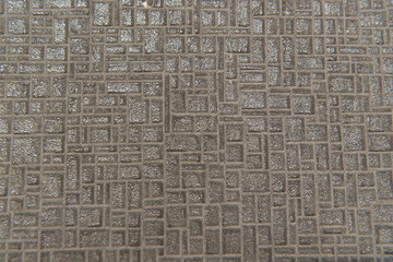 Sticker - background of grey, textured surface, with abstract volumetric pattern, top view