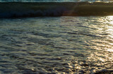 Fototapeta Na sufit - Amazing sea sunset, the sun, waves, clouds