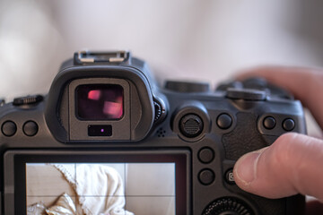 Sticker - Close up of the screen of a professional digital camera on a tripod while shooting a home composition.