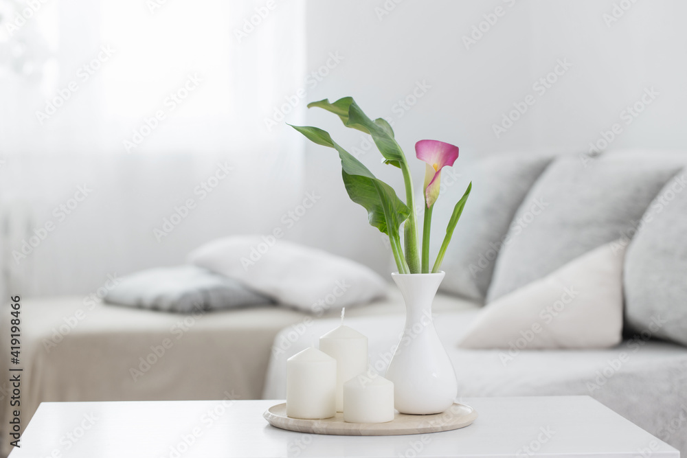 flowers in vase on white table indoor - obrazy, fototapety, plakaty 