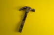 © Dmitriy - A broken hammer on a yellow background. Cool banner for DIY advertising