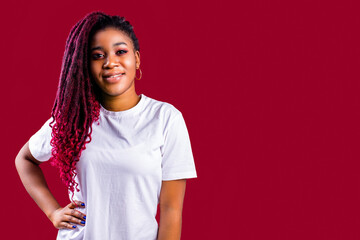 Awesome african woman with dreadlocks in studio wear white cotton t-shirt