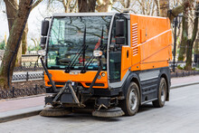 Garbage Collection Machine On The City Streets. The Problem Of Cities Is A Lot Of Rubbish. The Sweeper Works Instead Of The Windshield Wipers.