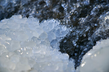 Ice texture. Frozen mountain stream. Bizarre ice shapes. Frozen water