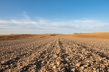 gravel road with blue sky