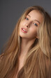 © Dmitry Tsvetkov - Natural portrait of young beautiful teen age girl with long straight hair. Female model studio shot against grey background. Pretty girl