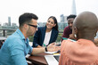 © Himalayan Pics/Caia Image - Business people meeting on urban office balcony, London, UK