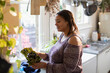 © Tom Merton/Caia Image - Woman with fresh lettuce cooking in kitchen