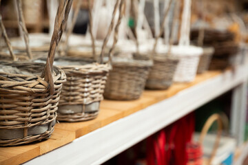 Wall Mural - Variety of wicker baskets on shelves in home decor store