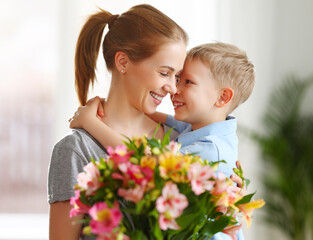 Poster - Happy woman and boy with flowers touching nose