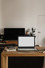 Wall Mural - Blank screen laptop computer. Home office desk table workspace. Modern nordic interior design. Copy space mockup template. Front view work at home, pandemic quarantine self-isolation business concept.