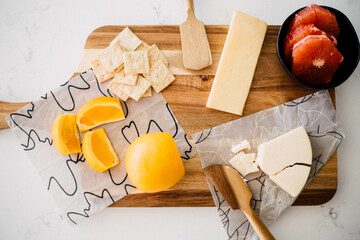 Cheese Crackers and Fruit on Cutting Board