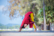 © APchanel - Sport woman wear India sport wear style posing practice yoga on beach  ,yoga is healthy sport balance meditation body concept.