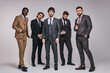 © Roman - bearded brutal guys in classic suits posing with serious facial expression, young men in tux looking at camera, smart and intelligent. portrait