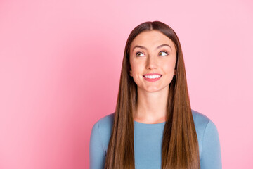 Wall Mural - Photo of adorable cheerful person toothy smile look interested empty space isolated on pink color background