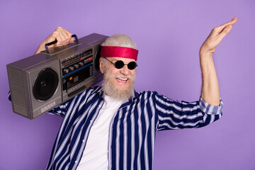 Photo of aged crazy man happy smile hold boombox excited dance isolated over violet color background