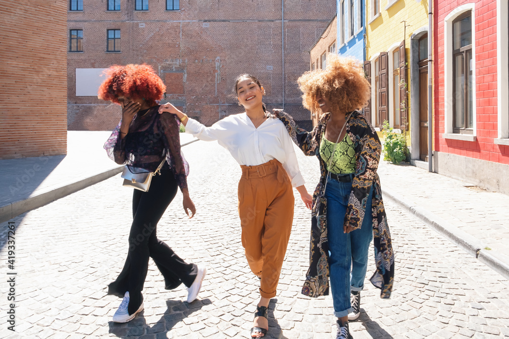 multiethnic happy friends young women laugh together. Female people smile and joy of friendship. urban youth gen z concept. - obrazy, fototapety, plakaty 