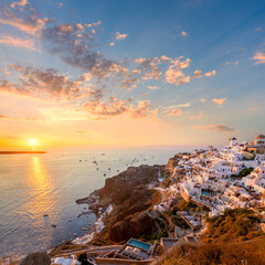 Wall Mural - Sunset view of famous Greek village Oia on Santorini island in Greece