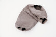 old holey sock on a white background. Poverty.