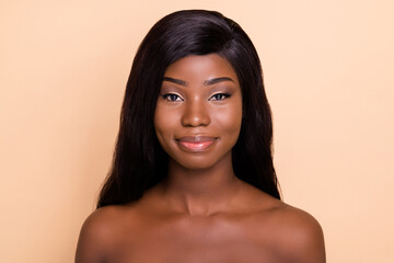 Poster - Photo of adorable smiling dark skin nude woman smooth fresh skin isolated beige color background