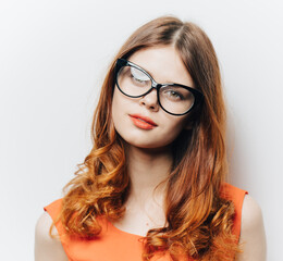 pretty woman in orange sundress and glasses makeup portrait