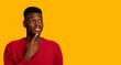 © Prostock-studio - Nice Offer. Pensive African Male Looking Aside At Copy Space With Interest
