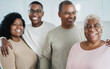 © DisobeyArt - Happy african family smiling in front of camera at home - Mother, son, daughter and father having fun together at home - Love concept - Main focus on woman face