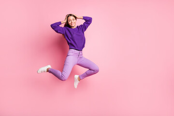 Wall Mural - Full size photo of optimistic girl jump wear lilac sweater trousers sneakers isolated on pink color background