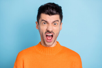 Canvas Print - Photo of furious handsome guy open mouth fuming yell noise wear sweater isolated on blue color background