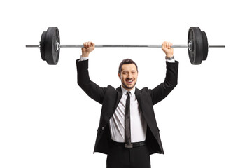 Businessman lifting weights and smiling