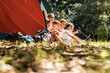 © BalanceFormCreative - Group of school children sitting in tent with they female teacher.