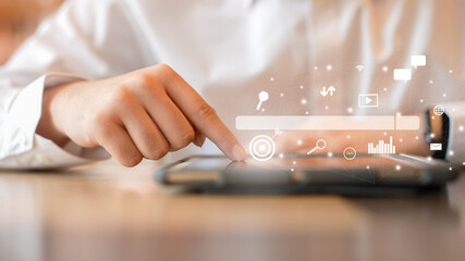 Wall Mural - close up man hand touchscreen on tablet to use search engine optimization (seo) tools for find custo