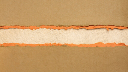 paper abstract in brown, orange and beige with a copy space - sheets of handmade paper, diagonal blank web banner