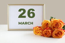 Day Of The Month 26 March Calendar Photo Frame And Yellow Rose On A White Table