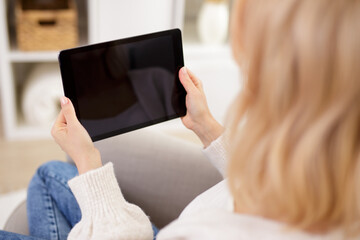 modern tablet pc with blank screen in female hands