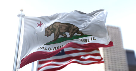 The California Republic flag with the grizzly bear Monarch flying along with the American national star-striped flag.