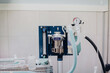 © Alberto Ortega/ADDICTIVE STOCK - Anesthesia machine with ribbed plastic hoses near metal canister and pressure manometer on top in vet hospital