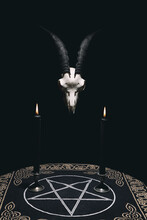 Witchcraft Composition With Goat Skull, Candles And Pentagram Symbol. Halloween And Occult Concept, Black Magic Ritual. 
