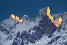 Spectacular Landscape Of Mountain Range Covered With Snow At Sunset In Cold Winter