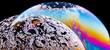 © David Espejo/ADDICTIVE STOCK - Panoramic view of closeup bubble textured backdrop representing colorful planets with wavy lines on round shaped surface on black background