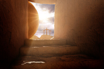 Canvas Print - Crucifixion and Resurrection. Empty tomb of Jesus with crosses in the background. Easter or Resurrection concept. He is Risen. Happy Easter.