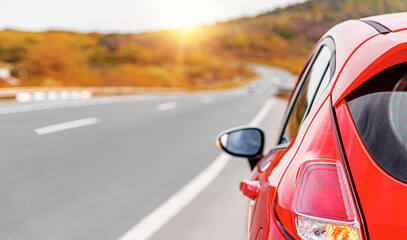 Wall Mural - Red car on the side of the highway. Road trip.