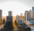 © Jordi Bataller/ADDICTIVE STOCK - Drone view of modern skyscrapers and multistory buildings located in city district against cloudless sundown sky in Australia