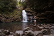 © Juan Alberto Ruiz/ADDICTIVE STOCK - Side view of female tourist standing on rock near Tiemu Falls in forest in Taiwan