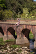 © Juan Alberto Ruiz/ADDICTIVE STOCK - Side view of Asian female in dress sitting on old Daping Red Bridge and enjoying summer vacation in Taiwan